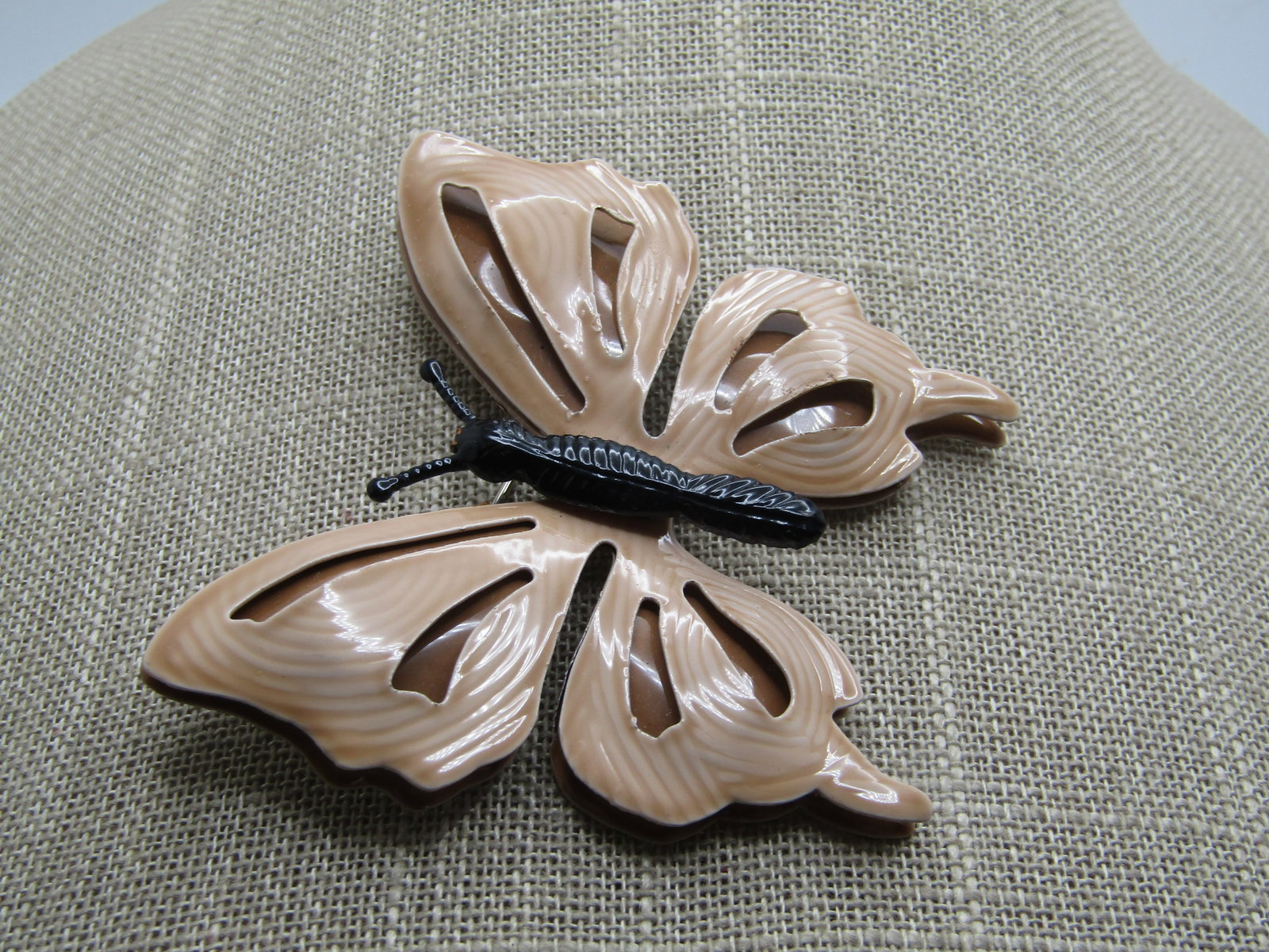 Vintage Black & Tan Enameled Butterfly Brooch, 1960's: Vintage Black & Tan Enameled Butterfly Brooch, 1960's. Two tiers of wings - top have a cut-out design in them. The wings are tan and torso is black enameled. the brooch is appx. 2.5" tall and wide. Wh