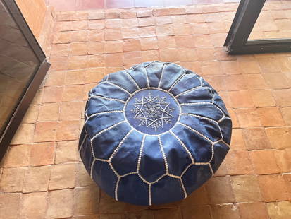 Blue Moroccan Leather Pouf: Title: Blue Moroccan Leather Pouf Provenance: Made: Handmade in Morocco Materials: 100% original leather No bad Leather Smell Size: 21? in x 13? in (53 x 33 cm) Stuffing: unfilled worldwide shipping F