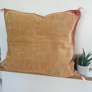 Faded Rust and Blue Cactus Silk Cushion: Title: Faded Rust and Blue Cactus Silk Cushion Provenance: These Beautiful cactus silk cushions are handmade by artisans from Morocco. Each have unique hand stitched Berber symbols of varying colours