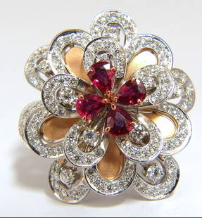 2.36Ct Natural Ruby Diamonds 4 Tier 3D Cocktail Petal Diamond Ring 18kt+: 3D Petal Leaf 4 tier cocktail ring 1.06ct round diamonds G-color vs-2 clarity 1.30ct natural pear shaped rubies clean clarity, transparent and vivid red. 18kt. white gold 19 grams Ring Current size: 7