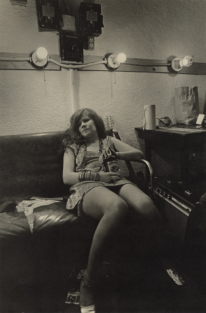 JIM MARSHALL - Janis Joplin Sitting on Couch Backstage: Artist: Jim Marshall Title: Janis Joplin Sitting on Couch Backstage at Winterland, San Francisco, CA, 1968 Medium: Photo Litho, 1973, USA Dimensions: 8.95x13.55" Description: Heat Wax Mounted on 12x16