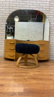 Mid Century Modern Heywood Wakefield Crescendo Vanity with Mirror and Vanity Stool/Poof: vanityMid Century Modern Heywood Wakefield Crescendo Vanity with Mirror and Vanity Stool/Poof Offered is a Mid Century Modern Vanity with Mirror and a vanity poof/Stool was designed by Count Alexis De
