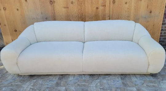 Vintage Post Modern Jean Royere Style Sofa Newly Reupholstered: Vintage Post Modern Jean Royere Style Sofa Newly Reupholstered in a High End Natural Shearling "Polar Bear" Unique & Exquisite Post-Modern Oversized Curved-Arm Jean Royere Style "Polar Bear" Sofa. Thi
