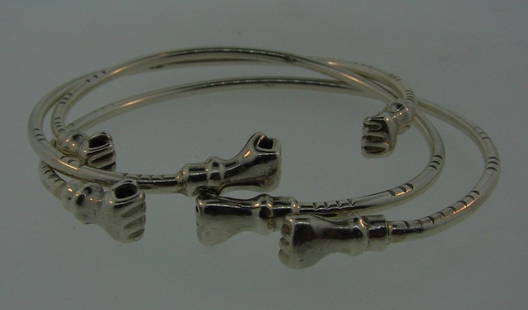 WOW Berlin Trio of Sterling Silver Bangles With A Hand Motif: DK Berlin Sterling Silver Trio of Bangles · Wonderful bangles that is a necessity in your collection. · The weight is 37.6 grams. · The length varies because they do not close. The leng