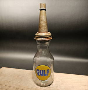 Gulf Glass Oil Bottle w Spout: 11" Tall 4" Wide Such a neat reproduction glass oil bottle. Wonderful signs of wear and distress. Hard to tell its age! Looks great on display! All our items come with a 100% customer satisfaction