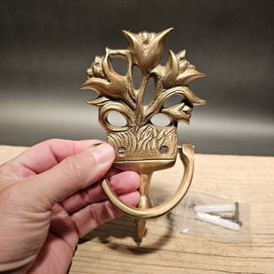 Brass Floral Door knocker: 6 1/2" Tall x 3 5/8" Wide Great reproduction floral door knocker cast from an antique. Really great authentic looking detail and slight antique patina. This piece is in natural brass so it will age ac