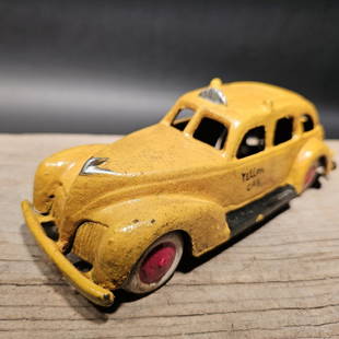 Cast Iron Yellow Cab Car: 7 1/2" Long x 2 3/4" Wide 3" Tall Such a neat reproduction cast iron car! As you can see this heavy cast iron car was wonderfully hand painted and distressed to look original. The car is mostly