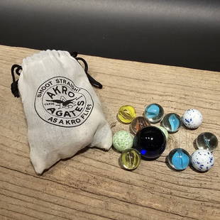 Akro Agates Bag with Glass Marbles: Wonderful reproduction Akro marbles bag with modern glass marbles included. All our items come with a 100% customer satisfaction guarantee. About the Items: Each item is inspected before shipping