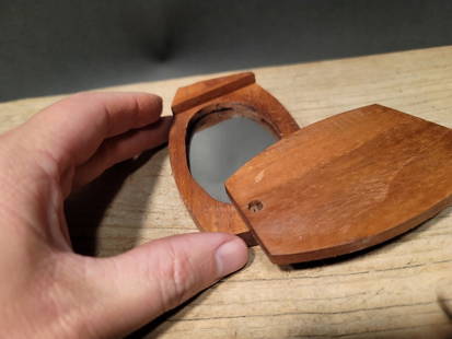 Primitive Folding Swivel Hand Mirror: 4 1/8" Long x 2 5/8" Wide 3/4" Thick Beautiful and creative reproduction wood swivel mirror. All wood and glass. Great for use or display. Certain to be a great addition to any period decor. Great for