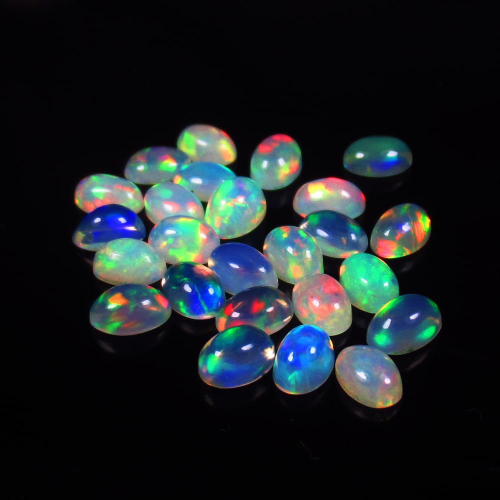 Natural Multicolor Opal Lot - 9.08 Ct: Title: Natural Multicolor Opal Lot - 9.08 Ct Origins: Ethiopia Weight: 9.08 Size/Dimension: 6.0x4.0 - 6.3x4.2 mm Additional Information: Pieces : 25 No's / Shape : Oval Cab / Clarity : Translucent / T