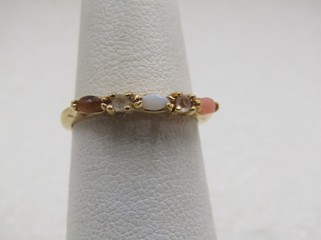 Vintage 10kt Opal, Pink Coral, Tiger's Eye Ring, Sz 6.: Vintage 10kt opal, pink coral, tiger's eye cz ring, sz 6.1. 49 gr. This has a center cateye shaped opal with a same cut tiger's eye on one end and pink coral on the other with a singe round cz on eith