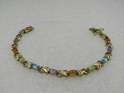 Vintage 14kt Mixed Gemstone Tennis Bracelet, Signed, 7.5", Appx. 10.42gr.: Vintage 14kt Mixed Gemstone Tennis Bracelet, Signed, 7.5", Appx. 10.42gr. 6mm wide, safety lock. Marquise stones in peridot, amethyst, citrine and blue topaz. With open X-links between. Marked 14kt an