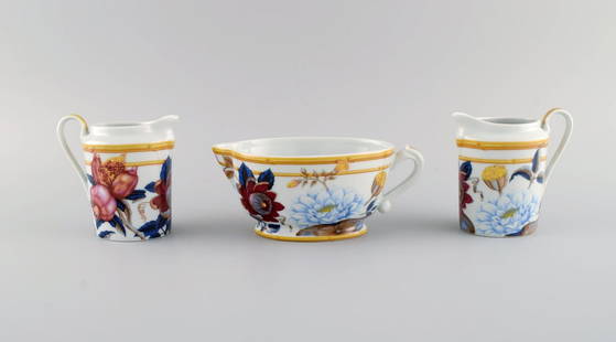 Porcelain of Paris. "Tropical Aurore". Three porcelain jugs decorated with flowers, pomegranates and: Porcelain of Paris. "Tropical Aurore". Three porcelain jugs decorated with flowers, pomegranates and bamboo. 1980s. Largest measures: 17 x 7.5 cm. Smallest measures: 10 x 10 cm. In excellent condition