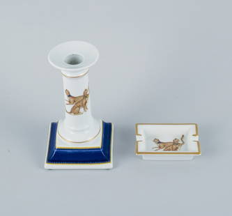 Porcelaine de Paris (Décor - Chasses Royales). Candlestick and small bowl hand-decorated with: Porcelaine de Paris (Décor - Chasses Royales). Candlestick and small bowl hand-decorated with cheetahs and gold decoration. Approx. 1980s. In perfect condition. Marked. Candlestick dimensions: H