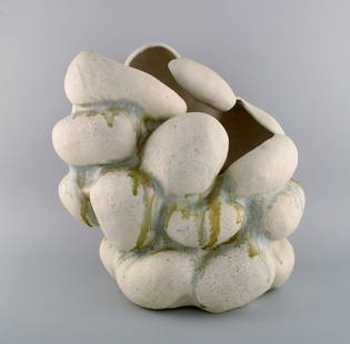 Christina Muff, Danish contemporary ceramicist (b. 1971). Hand modeled sculptural vase of stoneware: Christina Muff, Danish contemporary ceramicist (b. 1971). Hand modeled sculptural vase of stoneware clay. The vessel is glazed with warm white glaze mixed with minerals from Danish beaches and has ash