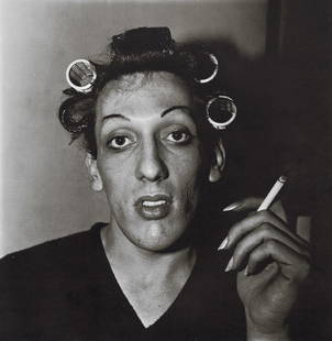 DIANE ARBUS - A Young Man in Curlers at Home, 1966: Artist: Diane Arbus Title: A Young Man in Curlers at Home on West 20th Street, NYC, 1966 Medium: Photo Litho, 1972, USA Dimensions: 8.35x8.55" Description: Heat Wax Mounted on 11x14" Conservation Boar