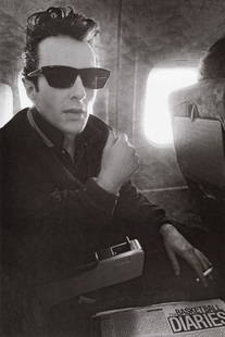 BOB GRUEN - Joe Strummer on Plane, USA, 1980: Artist: Bob GruenTitle: Joe Strummer on Plane, USA, 1980Medium: Photo Litho, 2011, ChinaDimensions: 7.3x11"Description: Heat Wax Mounted on 11x14" Conservation BoardArtist Bio: Bob Gruen (1945) is