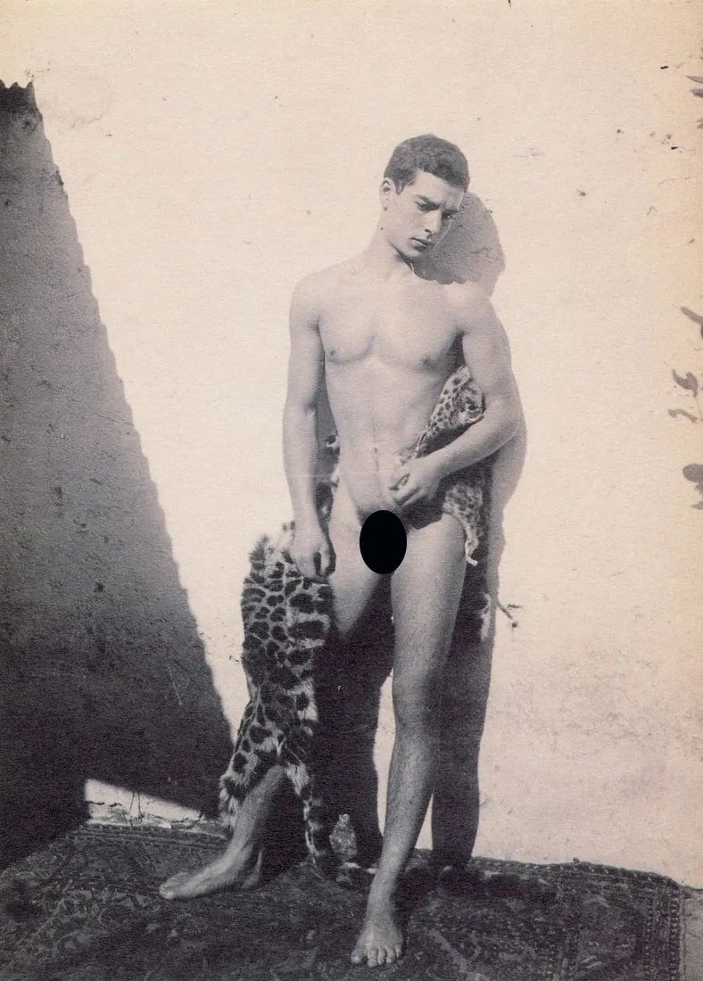 WILHELM VON GLOEDEN - Male Figure with Pelt: Artist: Wilhelm Von Gloeden Title: Male Figure with Pelt Medium: Photo Litho, 1986, USA Dimensions: 5.05x7" Description: Heat Wax Mounted on 8.5x11" Conservation Board Artist Bio: Baron Wilhelm von Gl