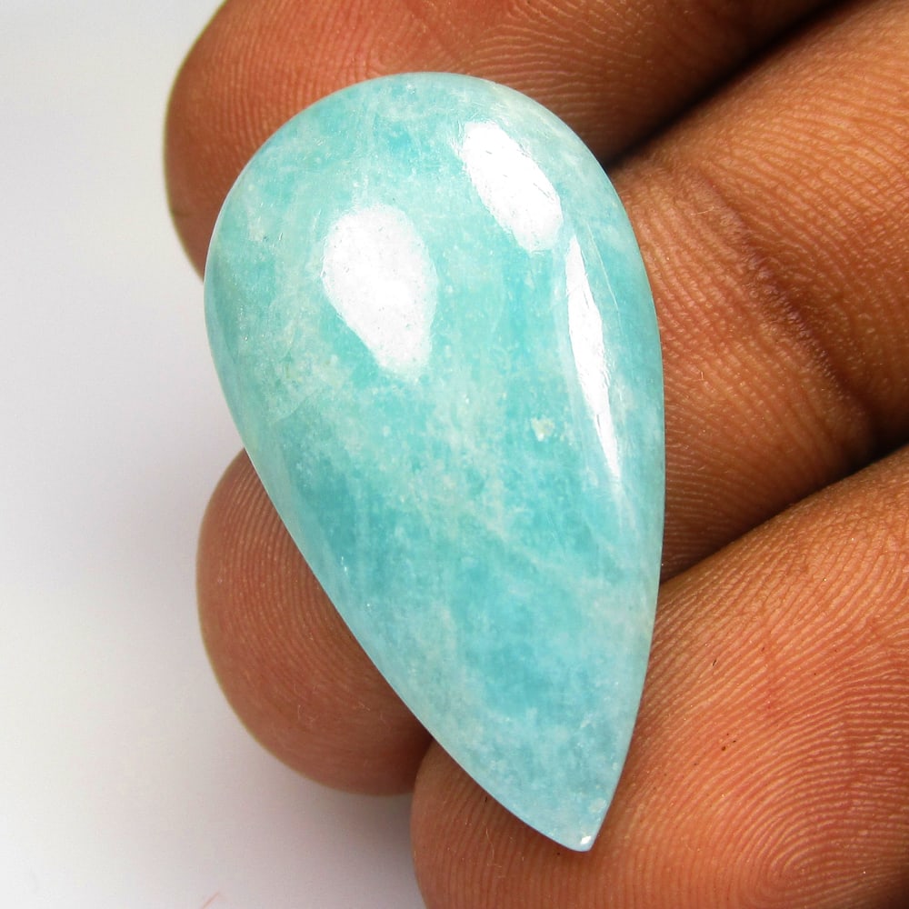 16.41 Ctw Natural Amazonite Pear Cab: No Reserve! Title: 16.41 Ctw Natural Amazonite Pear Cab Stone Clarity: Opaque Gemstone:Natural Amazonite Carat Weights: 16.41 Size/Dimensions: 31.00 x 16.50 x 4.90 mm Additional Info:Pear Cab / Good Q