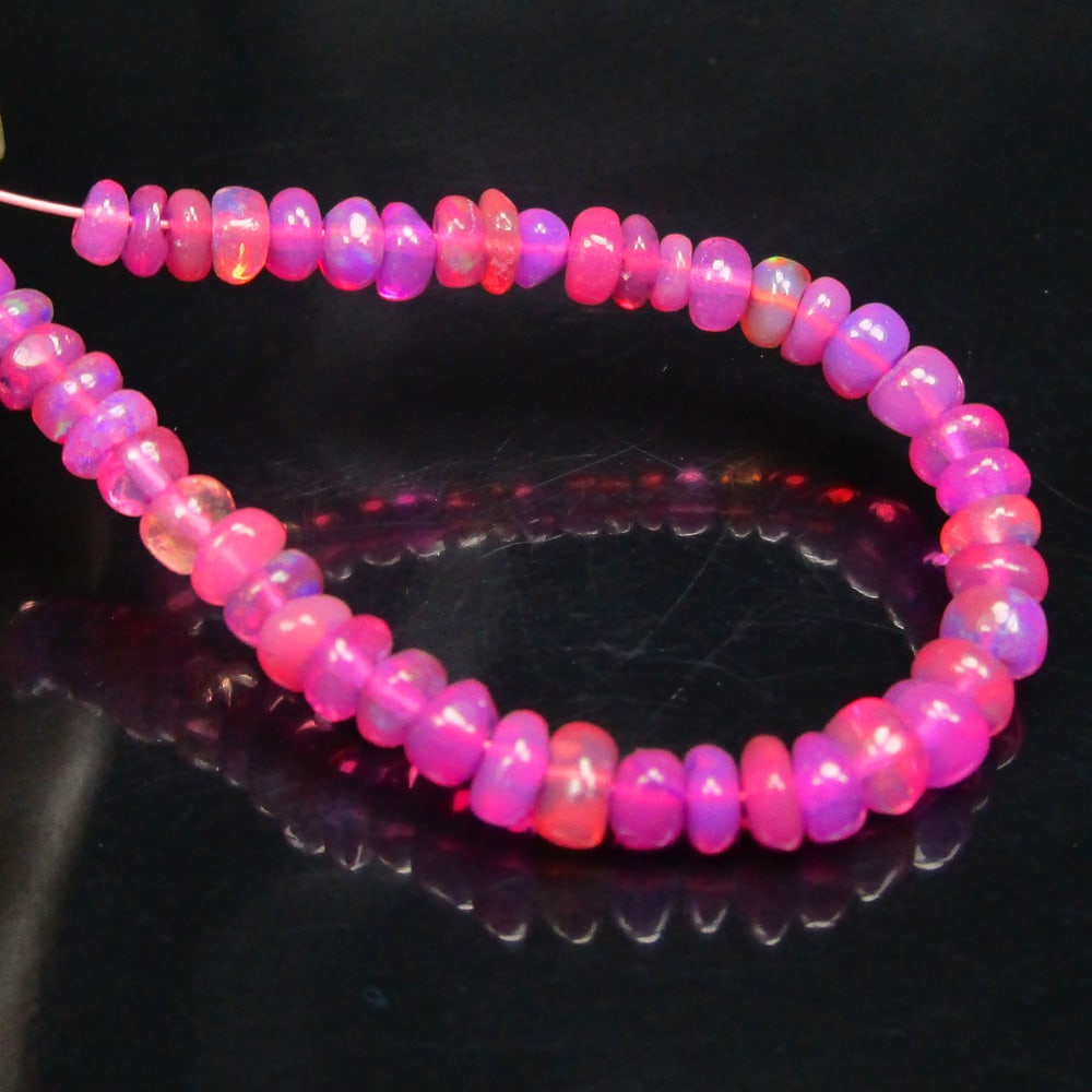 4.08 Ctw Natural 46 Drilled Pink Fire Opal Beads: No Reserve! Title: 4.08 Ctw Natural 46 Drilled Pink Fire Opal Beads Stone Clarity: Transparent Gemstone:Natural Opal Beads Carat Weights: 4.08 Size/Dimensions: 3.00 to 3.60 mm / 46 PC's Additional Inf