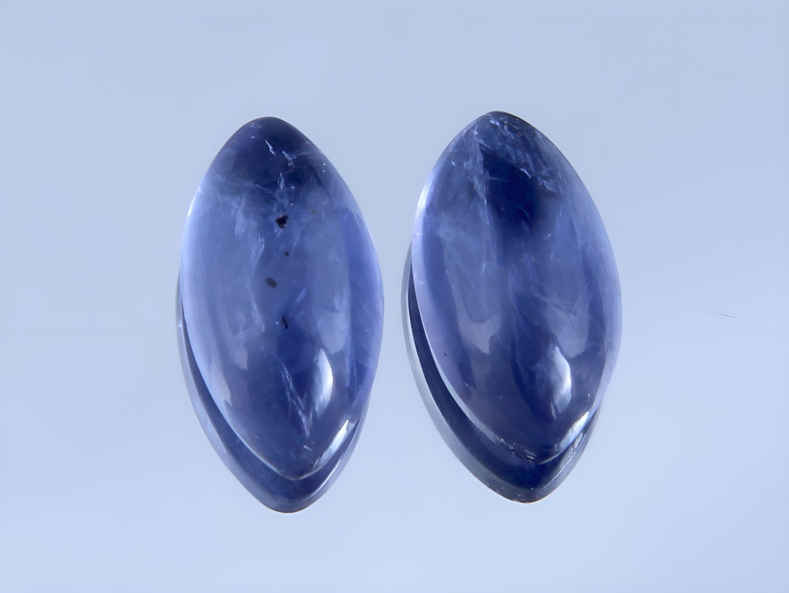Beautiful " Natural Iolite Violet " 2.86 Cts Natural Iolite Lot: No Reserve! Gemstone : Natural Iolite Shape and Cut : Marquies Cabochon Weight : 2.86 Carats Measurements : 10.37x5.51x3.60 mm, 10.18x5.62x3.78 mm Color : Violite Number of Stone : 2 Transparency : Tr