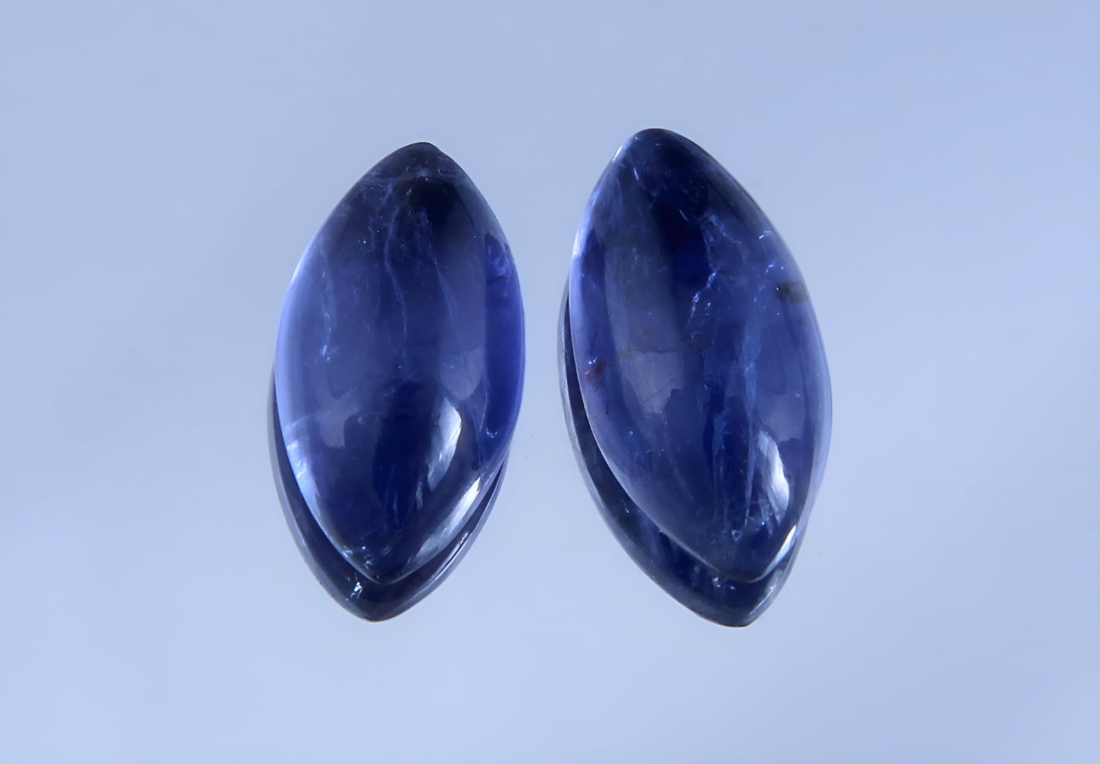 Awesome " Natural Iolite Violet " 2.38 Cts Natural Iolite Lot: No Reserve! Gemstone : Natural Iolite Shape and Cut : Marquies Cabochon Weight : 2.38 Carats Measurements : 10.18x5.34x3.38 mm, 9.91x5.33x3.33 mm Color : Violite Number of Stone : 2 Transparency : Tra