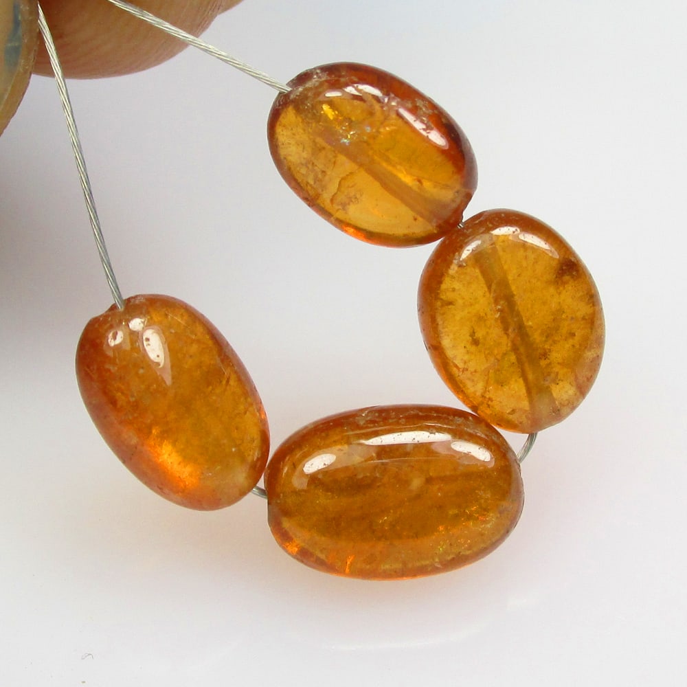 8.20 Ctw Natural 4 Hessonite Garnet Dumble Beads: No Reserve! Title: 8.20 Ctw Natural 4 Hessonite Garnet Dumble Beads Stone Clarity: Transparent Gemstone:Natural Hessonite Garnet Beads Carat Weights: 8.2 Size/Dimensions: 5.6x3.5- 6.4x3.6 mm / 4 Pc's 