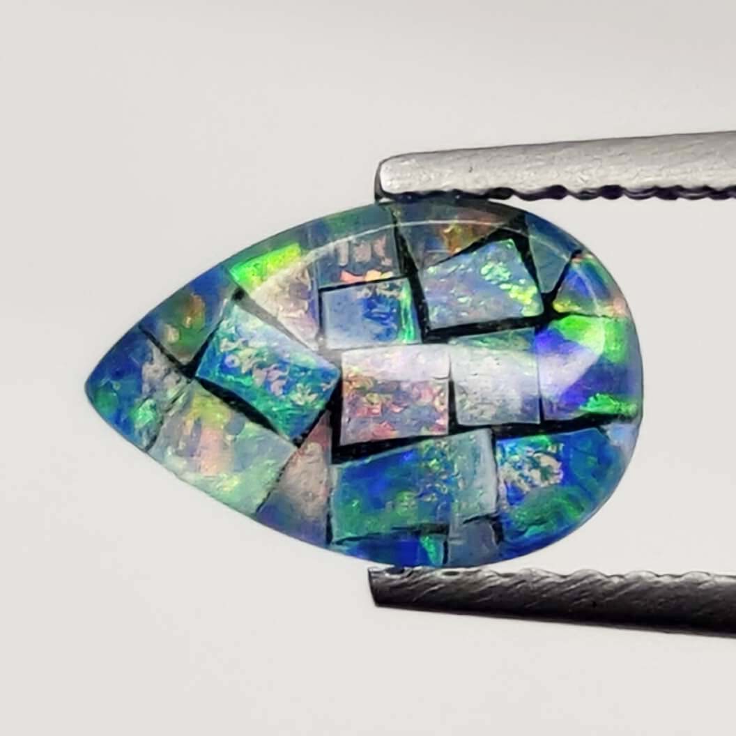 0.75 ct Australian Triplet Mosaic Opal: No Reserve! Title: 0.75 ct Australian Triplet Mosaic Opal Description: Gemstones: Australian Doublet Opal Carat Weights: 0.75 ct Size/Dimensions: 8.60 X 5.80 mm Shipping: Domestic: Flat-rate of $7.00