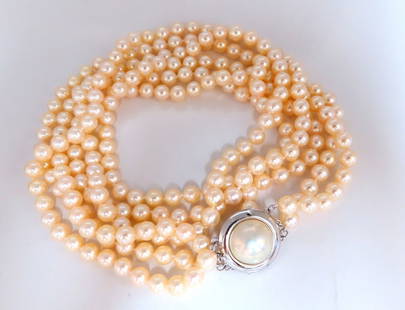 6.75 mm natural Japanese pearl & mabe Pearl 14 karat necklace: 6.75 mm natural Japanese pearls necklace. Three stranded cream off white color. AAA clarity 15 mm mabe Pearl 20 mm clasp $6,000 appraisal certificate to accompany ....*. Reserve: $2,400.00 