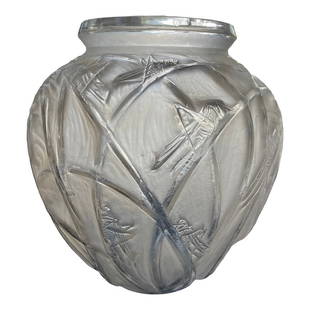 "Sauterelles" Vase by Rene Lalique From the Linda Ronstadt Collection: Designed by René Lalique in 1912, this Sauterelles pattern vase features details of whimsical grasshoppers resting on long reeds or blades of grass. The vessel highlights the master's love of