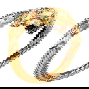 Vintage! Ilias Lalaounis 18k Yellow Gold Emerald Diamond Lioness Bangle Bracelet: The Vintage Ilias Lalaounis 18k Yellow Gold Emerald Diamond Lioness Bangle Bracelet is a rare and exquisite piece of jewelry. Crafted with meticulous Greek artistry, it showcases two lionesses in 18k