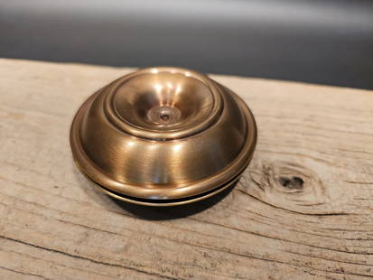 Brass Brighton Buns Traveling Candlestick Pair: Title: Brass Brighton Buns Traveling Candlestick Pair Description: 4" wide This charming replica of a 19th century primitive antique brass candle holders. Similar to the antique officers brighton bun