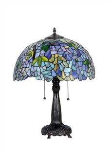 21" Stained Glass Wisteria Floral Table Lamp: 21.85" Tall x 16.5" wide Wonderful new reproduction stained glass table lamp. All handcrafted cut glass. The base resembling a tree is actually resin and metal made to look like bronze. It has 2