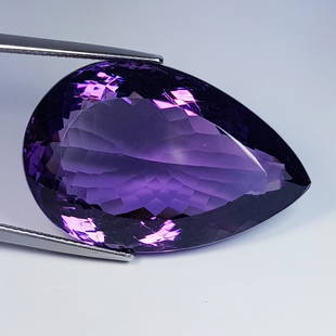 52.40 ctz" Exclusive Collection" Top Color Natural Amethyst: Title: 52.40 ctz" Exclusive Collection" Top Color Natural AmethystGemstones: AmethystColor/Clarity: Purple /IFCarat Weights: 52.4Size: 31.00 x 20.45 x 13.95Additional Information: Pear / Bolivia 