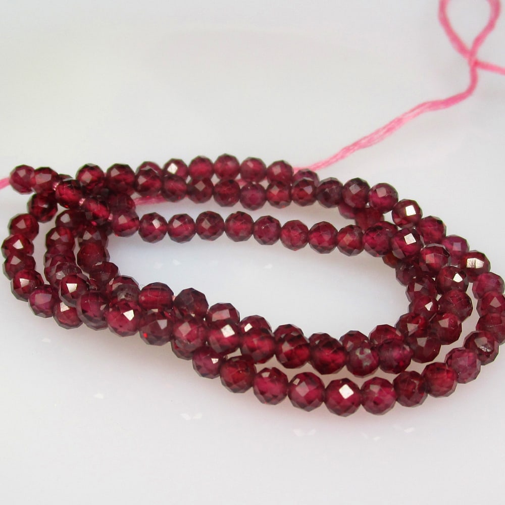 29.69 Ct Natural 112 Drilled Rhodolite Garnet Round Cut Beads: Title: 29.69 Ct Natural 112 Drilled Rhodolite Garnet Round Cut Beads Stone Clarity: VVS Gemstone:Natural Garnet Beads Carat Weights: 29.69 Size/Dimensions: 3.10 - 3.20 mm / 112 P'cs Additional Info:Dr