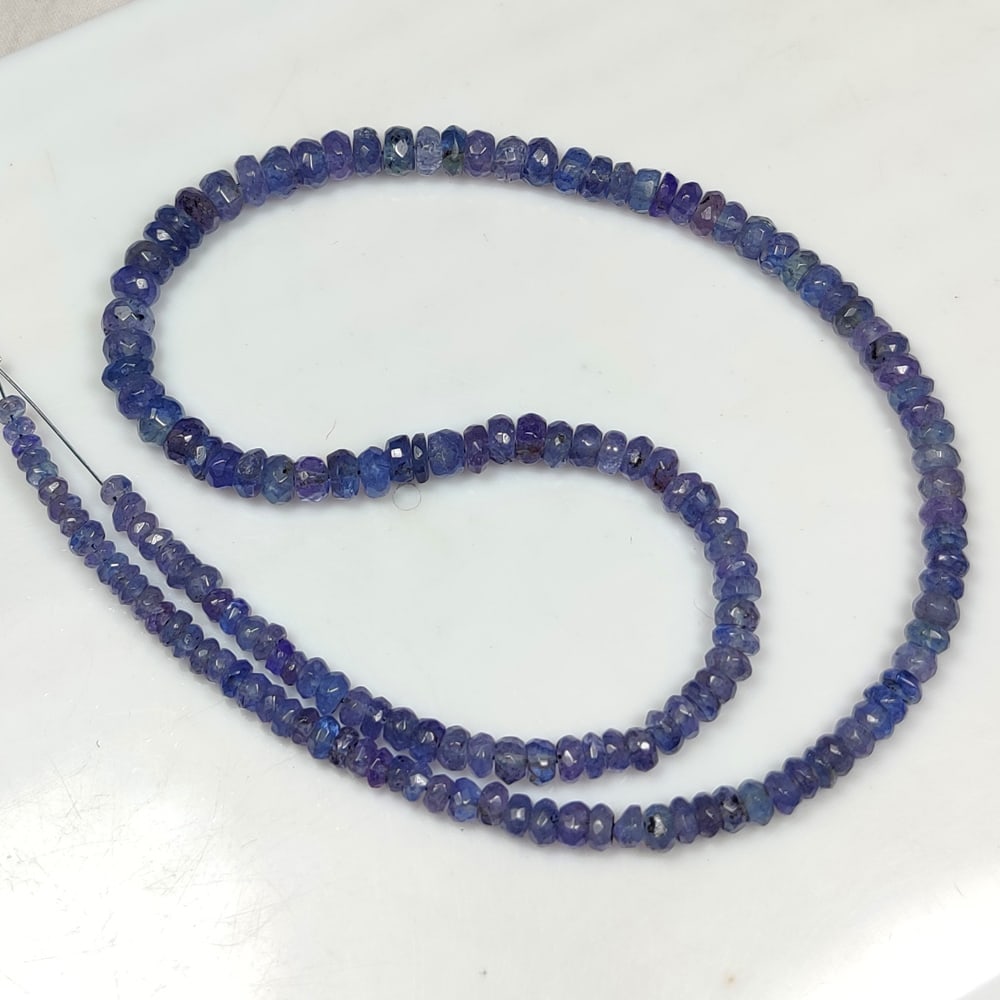67.51 Ctw Natural 161 Drilled Tanzanite Round Cut Beads: Title: 67.51 Ctw Natural 161 Drilled Tanzanite Round Cut Beads Stone Clarity: Transparent Gemstone:Natural Tanzanite Beads Carat Weights: 67.51 Size/Dimensions: 3.10 - 5.30 mm / 161 P'cs Additional In