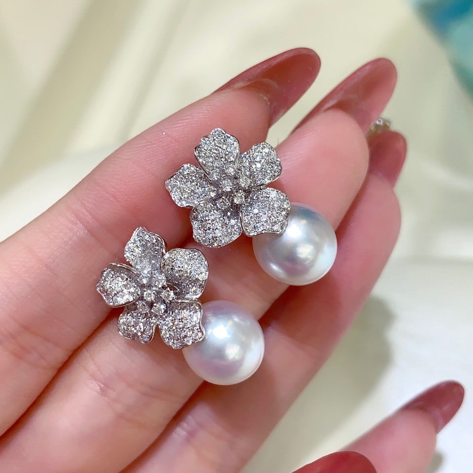 11~12mm Pearl Stud Earrings: 11~12mm pearl stud earrings. Flawless front with strong green-pink luster. Reserve: $400.00 Shipping: Domestic: Shipping rates are determined by destination. International: Foreign shipping rates are
