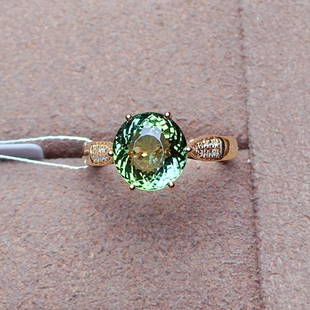 18k Gold Natural Tourmaline Ring: 18K gold natural tourmaline ring. 18K gold with diamond inlay. Total weight: 2.18g, main stone: 2.9ct, diamonds: 18 Reserve: $1,800.00 Shipping:Domestic: Shipping rates are determined by