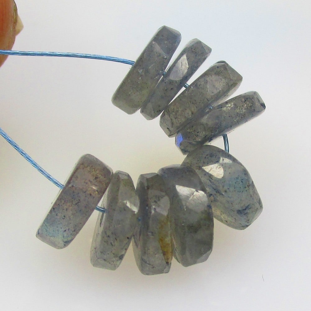 9.40 Ctw Natural 9 Labradorite Round Beads: No Reserve! Title: 9.40 Ctw Natural 9 Labradorite Round Beads Stone Clarity: Opaque Gemstone:Natural Labradorite Beads Carat Weights: 9.4 Size/Dimensions: 7.10 - 7.40 mm / 9 Pc's Additional Info:Excel