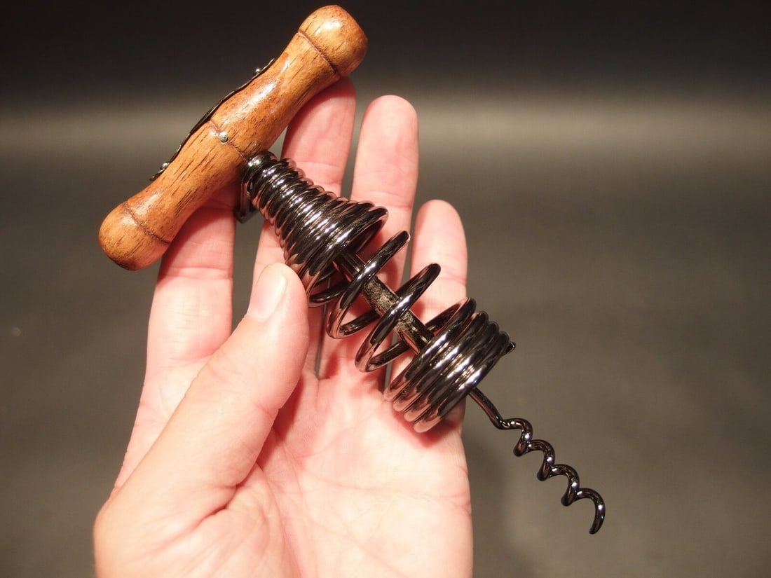 Spring Assisted Direct Pull Corkscrew Wine Bottle Opener: Antique Vintage Style Spring Assisted Direct Pull Corkscrew Wine Bottle Opener Description 6 1/8" Long x 3 1/2" Wide Great reproduction spring assisted direct pull corkscrew. This piece has a paper cl