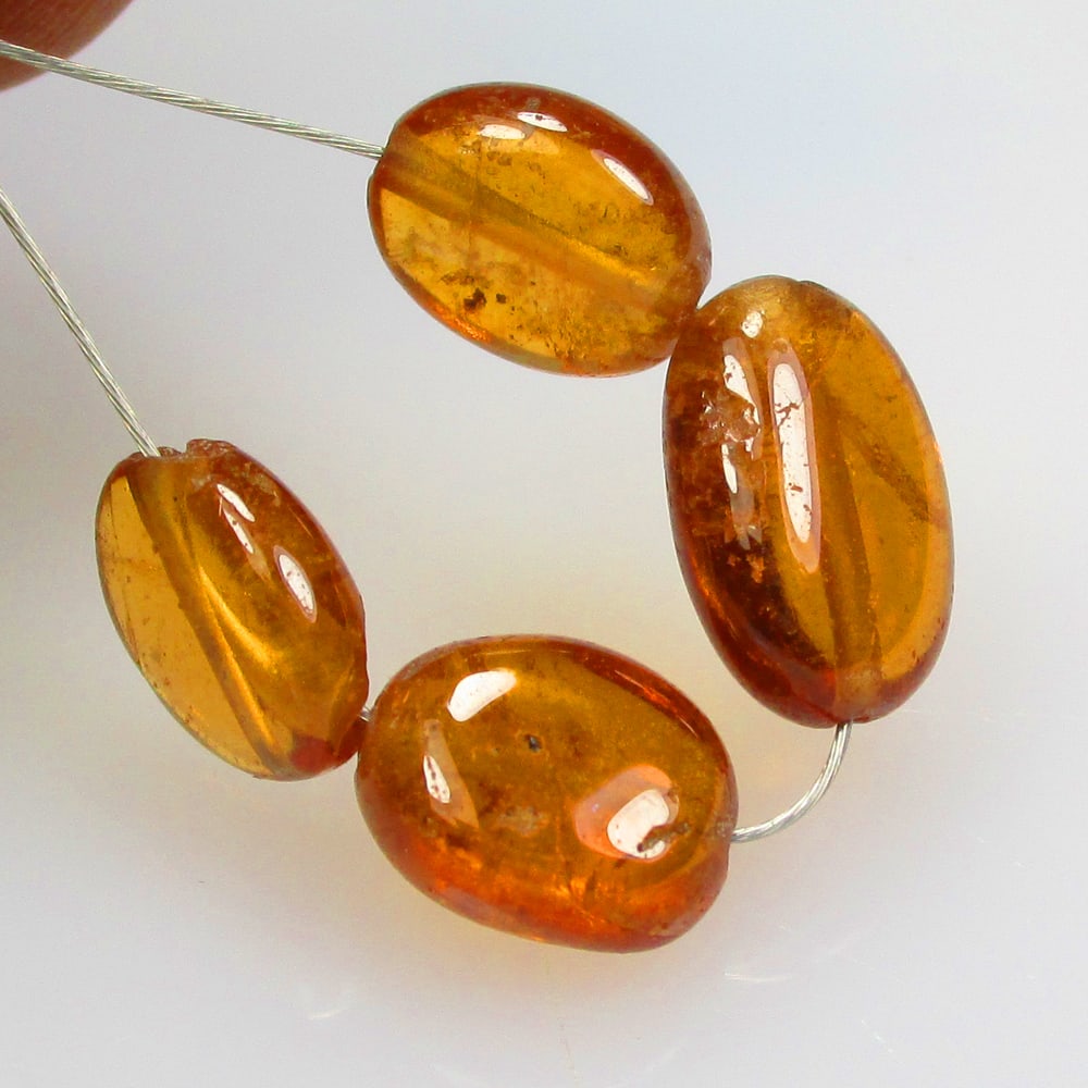 7.35 Ctw Natural 4 Hessonite Garnet Dumble Beads: No Reserve! Title: 7.35 Ctw Natural 4 Hessonite Garnet Dumble Beads Stone Clarity: Transparent Gemstone:Natural Hessonite Garnet Beads Carat Weights: 7.34 Size/Dimensions: 5.80 - 6.30 mm / 4 Pc's Addi