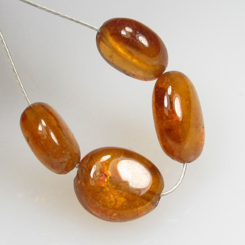 7.27 Ctw Natural 4 Hessonite Garnet Dumble Beads: No Reserve! Title: 7.27 Ctw Natural 4 Hessonite Garnet Dumble Beads Stone Clarity: Transparent Gemstone:Natural Hessonite Garnet Beads Carat Weights: 7.27 Size/Dimensions: 5.7x3.5- 6.5x3.6 mm / 4 Pc's