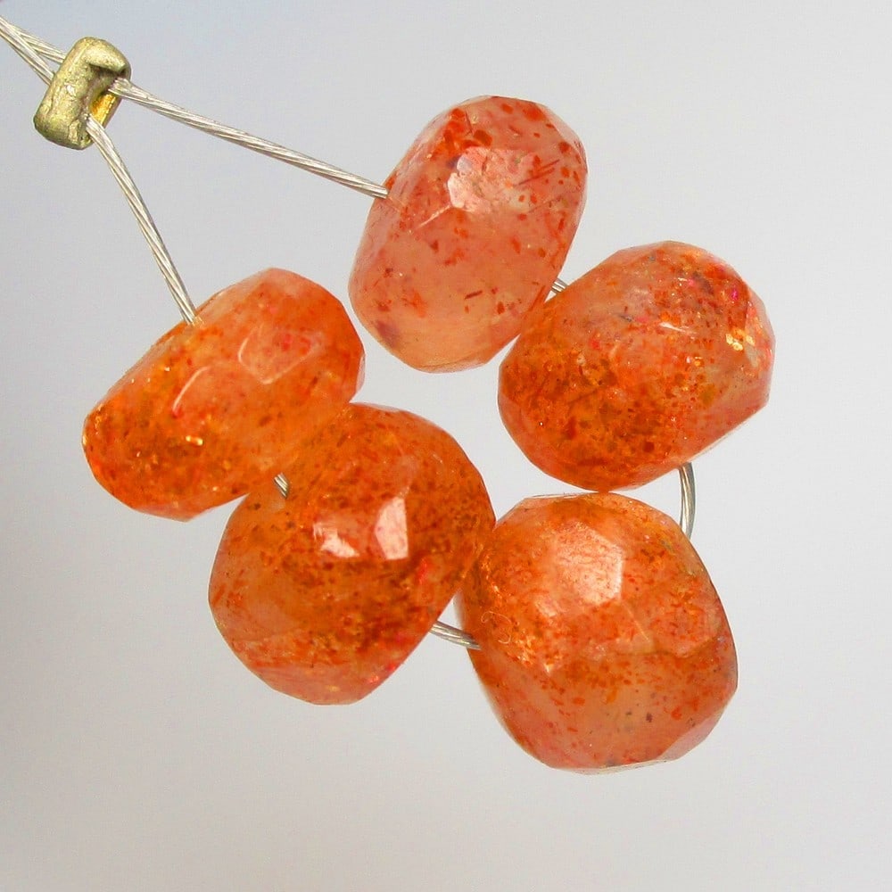6.19 Ctw Natural 5 Drilled Orange Sunstone Round Beads: No Reserve! Title: 6.19 Ctw Natural 5 Drilled Orange Sunstone Round Beads Stone Clarity: Opaque Gemstone:Natural Sunstone Beads Carat Weights: 6.19 Size/Dimensions: 6.00 - 6.40 mm / 5 Pc's Additional