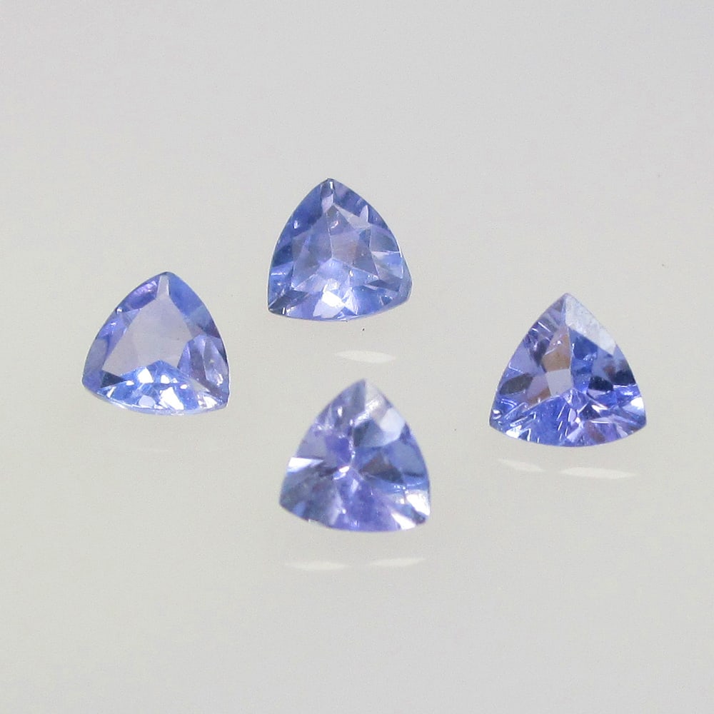 0.47 Ctw Natural 4 Tanzanite Trillion Set: No Reserve! Title: 0.47 Ctw Natural 4 Tanzanite Trillion Set Stone Clarity: VVS Gemstone:Natural Tanzanite Carat Weights: 0.47 Size/Dimensions: 3.2x1.6 - 3.3x2.1 mm / 4 Pc's Additional Info:Top Qualit