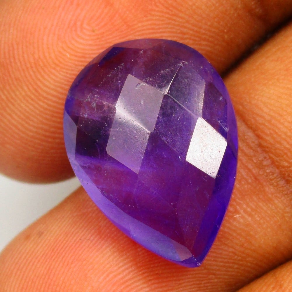 9.71 Ctw Natural Purple Amethyst Pear Checkerboard Cut: No Reserve! Title: 9.71 Ctw Natural Purple Amethyst Pear Checkerboard Cut Stone Clarity: VVS Gemstone:Natural Amethyst Carat Weights: 9.71 Size/Dimensions: 18.10 x 13.00 x 6.90 mm Additional Info:Exce