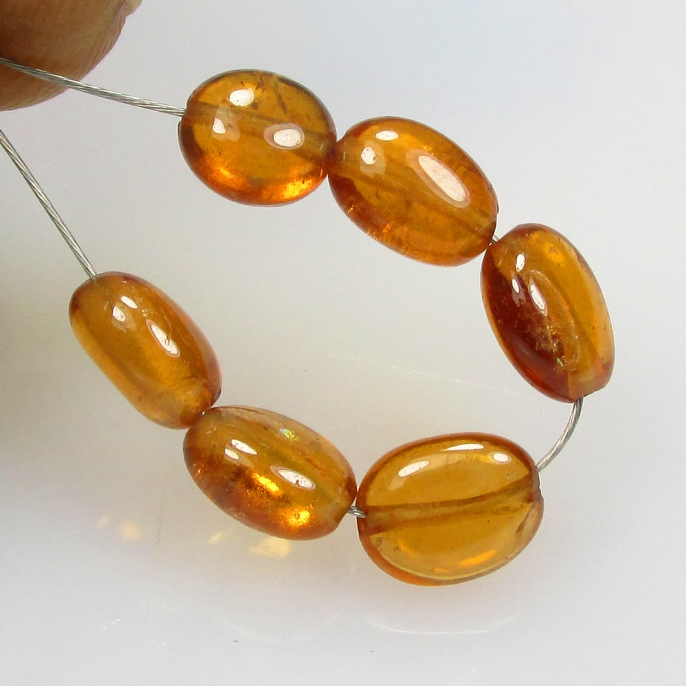 6.00 Ctw Natural 6 Hessonite Garnet Dumble Beads: No Reserve! Title: 6.00 Ctw Natural 6 Hessonite Garnet Dumble Beads Stone Clarity: Transparent Gemstone:Natural Hessonite Garnet Beads Carat Weights: 6 Size/Dimensions: 4.70 - 5.20 mm / 6 Pc's Additio