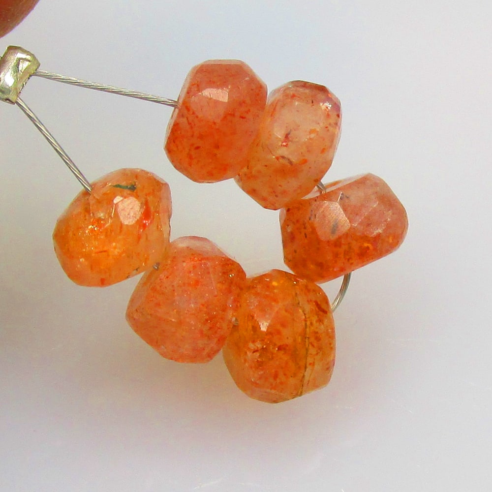 6.25 Ctw Natural 6 Drilled Orange Sunstone Round Beads: No Reserve! Title: 6.25 Ctw Natural 6 Drilled Orange Sunstone Round Beads Stone Clarity: Opaque Gemstone:Natural Sunstone Beads Carat Weights: 6.25 Size/Dimensions: 5.80 - 6.10 mm / 6 Pc's Additional