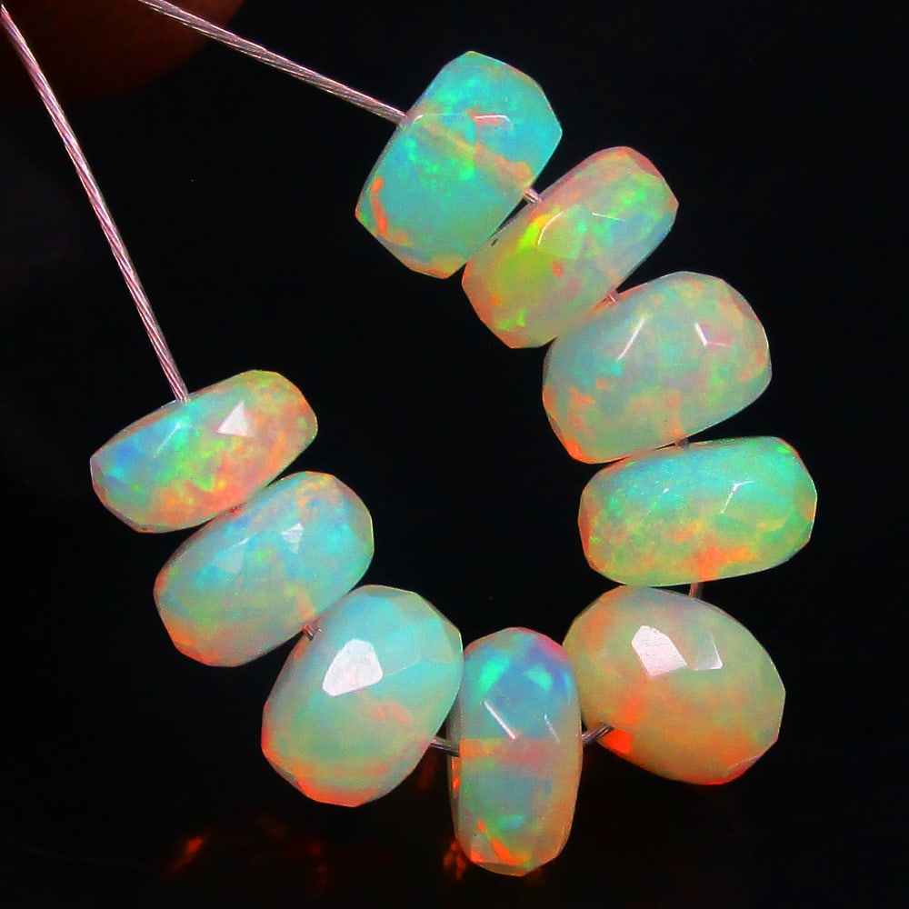 4.10 Ctw Natural 9 Ethiopian Drilled Fire Opal Beads: No Reserve! Title: 4.10 Ctw Natural 9 Ethiopian Drilled Fire Opal Beads Stone Clarity: Transparent Gemstone:Natural Fire Opal Beads Carat Weights: 4.1 Size/Dimensions: 5.10 - 5.50 mm / 9 Pc's Addition