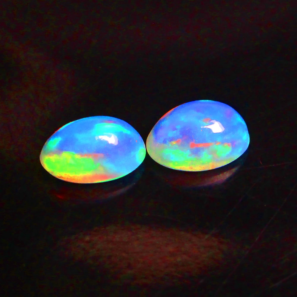 0.74 Ctw Natural Ethiopian Multicolor Opal Oval Pair: No Reserve! Title: 0.74 Ctw Natural Ethiopian Multicolor Opal Oval Pair Stone Clarity: Translucent Gemstone:Natural Opal Carat Weights: 0.74 Size/Dimensions: 6.00 x 4.10 x 3.00 mm / 2 Pc's Additional 