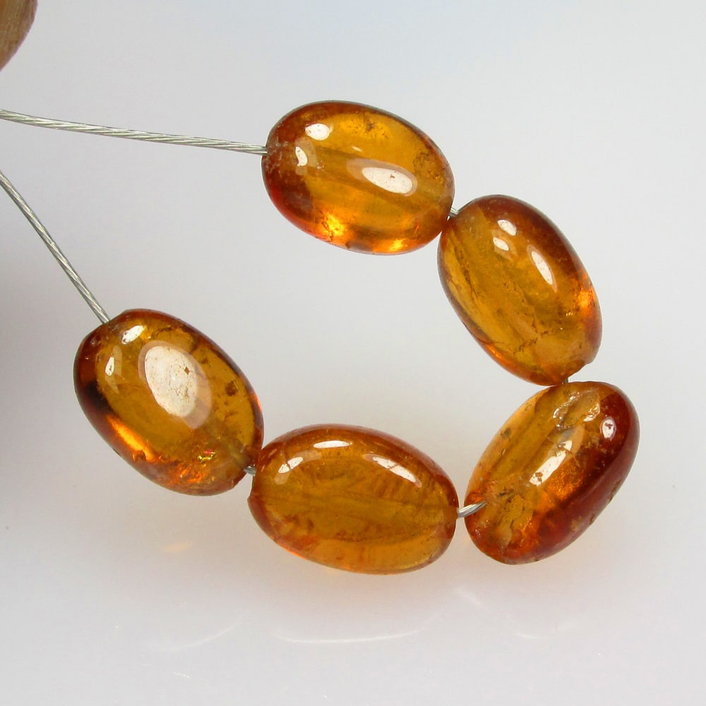 5.85 Ctw Natural 5 Hessonite Garnet Dumble Beads: No Reserve! Title: 5.85 Ctw Natural 5 Hessonite Garnet Dumble Beads Stone Clarity: Transparent Gemstone:Natural Hessonite Garnet Beads Carat Weights: 5.85 Size/Dimensions: 4.70 - 4.90 mm / 5 Pc's Addi